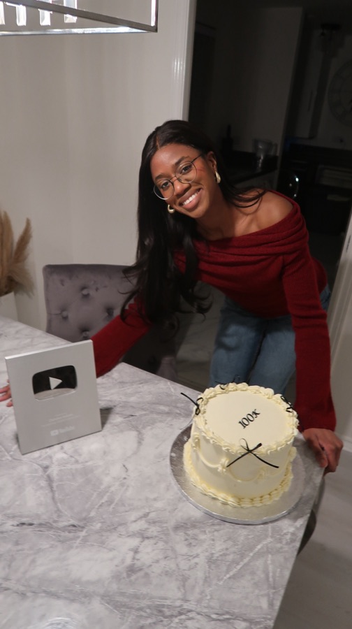 Christina celebrating her YouTube milestone